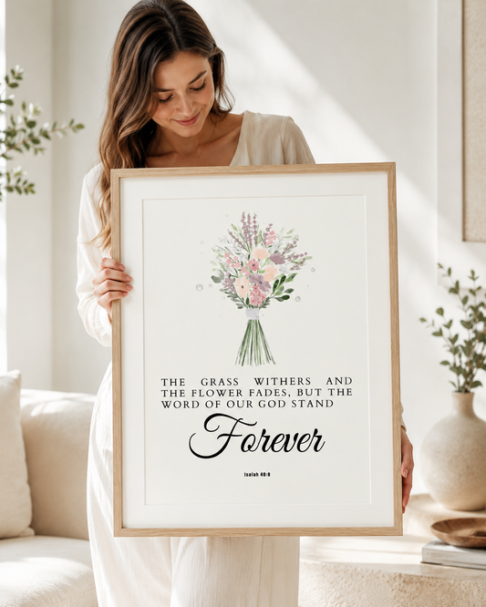 Woman holding a framed Isaiah 40:8 Bible verse print at home