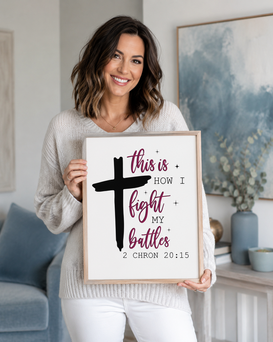 Woman holding a framed 2 Chronicles 20:15 Bible verse print at home