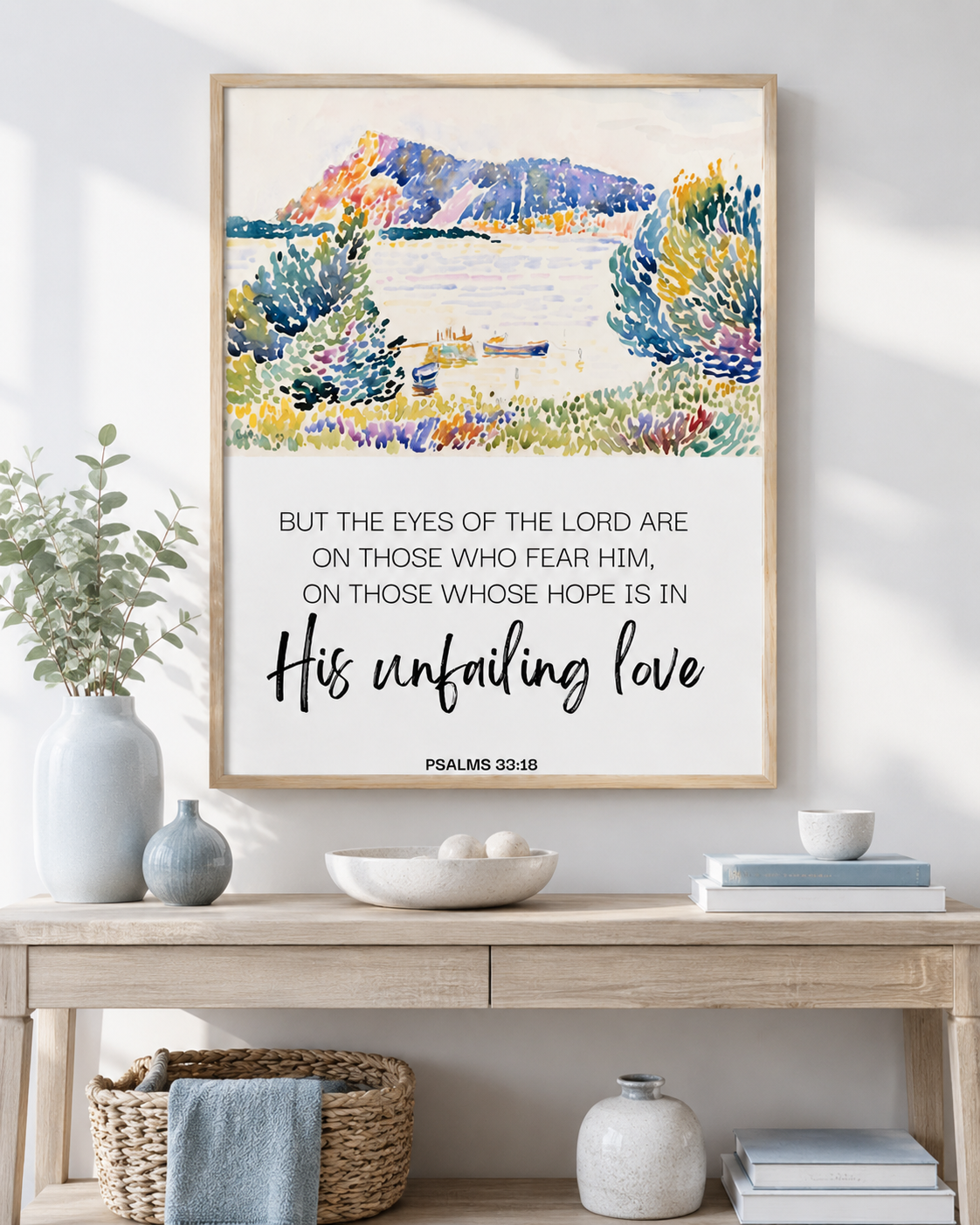 Psalm 33:18 Scripture print displayed above a wooden console in a bright neutral room