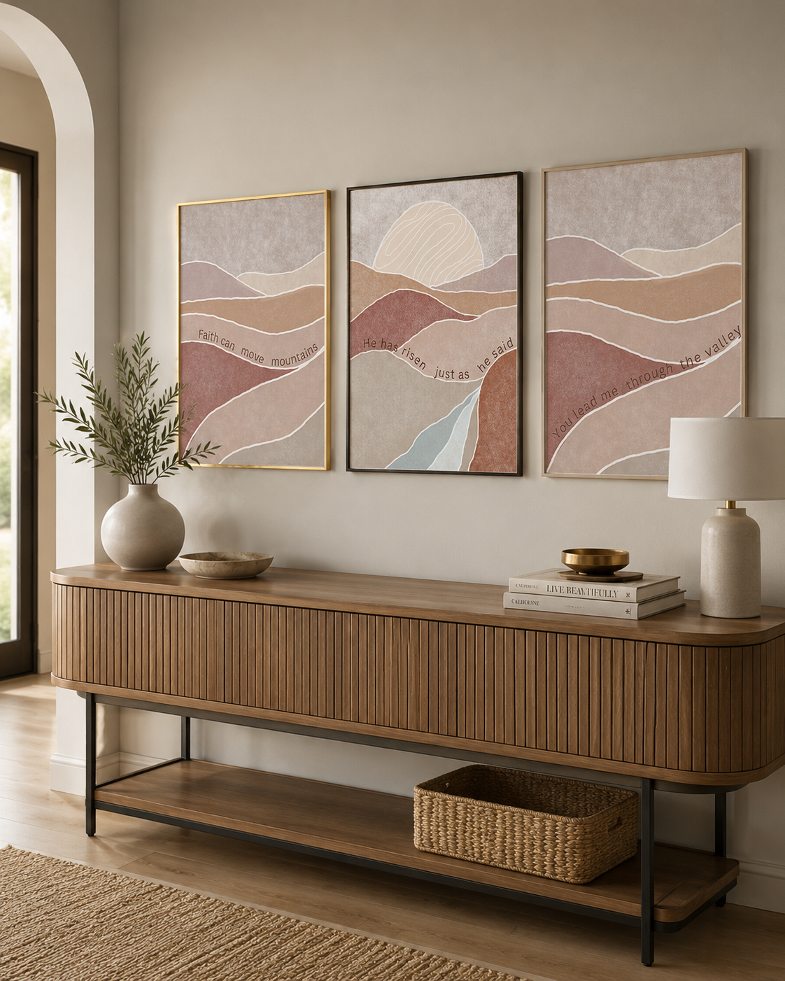 Set of 3 Faith Can Move Mountains prints above a console table in an entryway