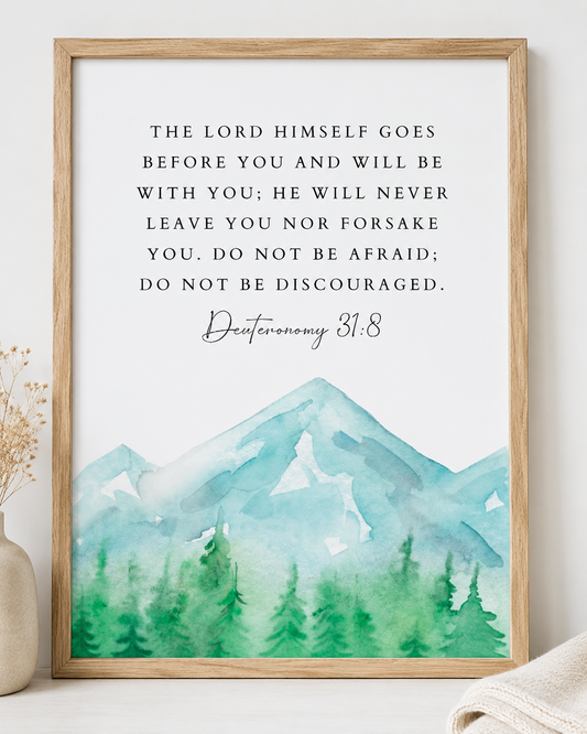 Close-up of Deuteronomy 31:8 wall art print in a wood frame showing the watercolor mountain design and full verse text