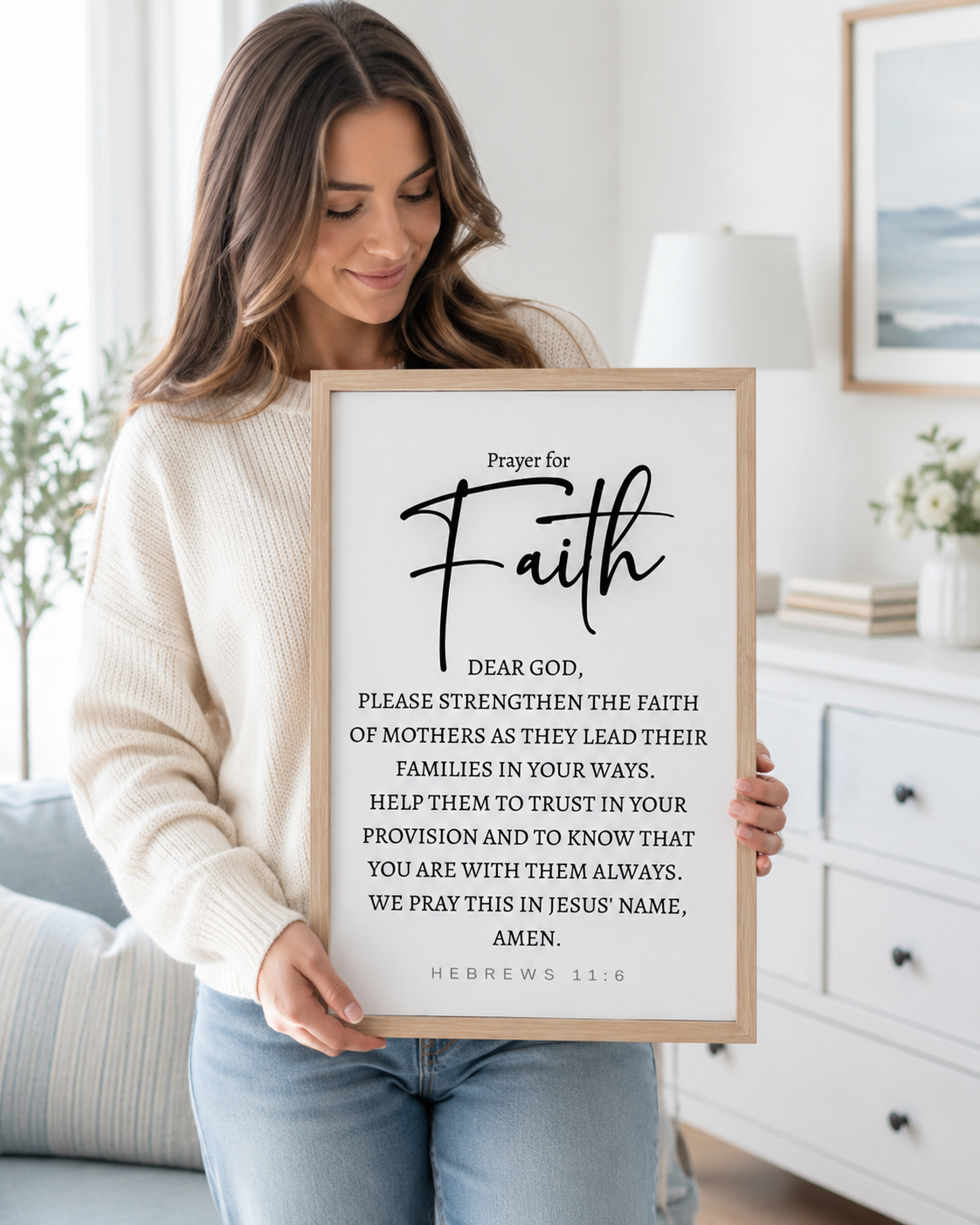 Woman holding a framed Hebrews 11:6 prayer print at home