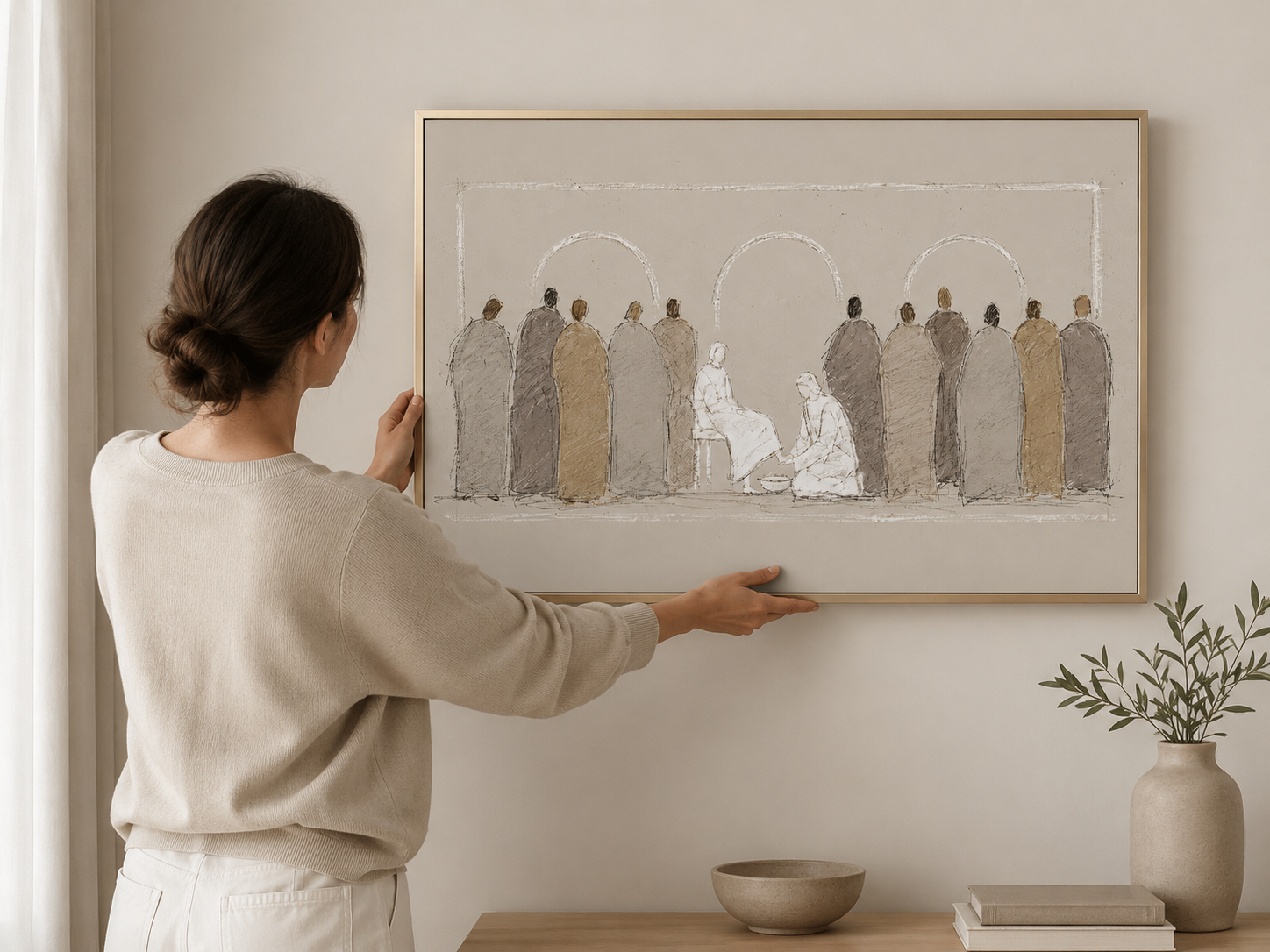 Woman hanging the Jesus Washes the Disciples' Feet wall art print on the wall