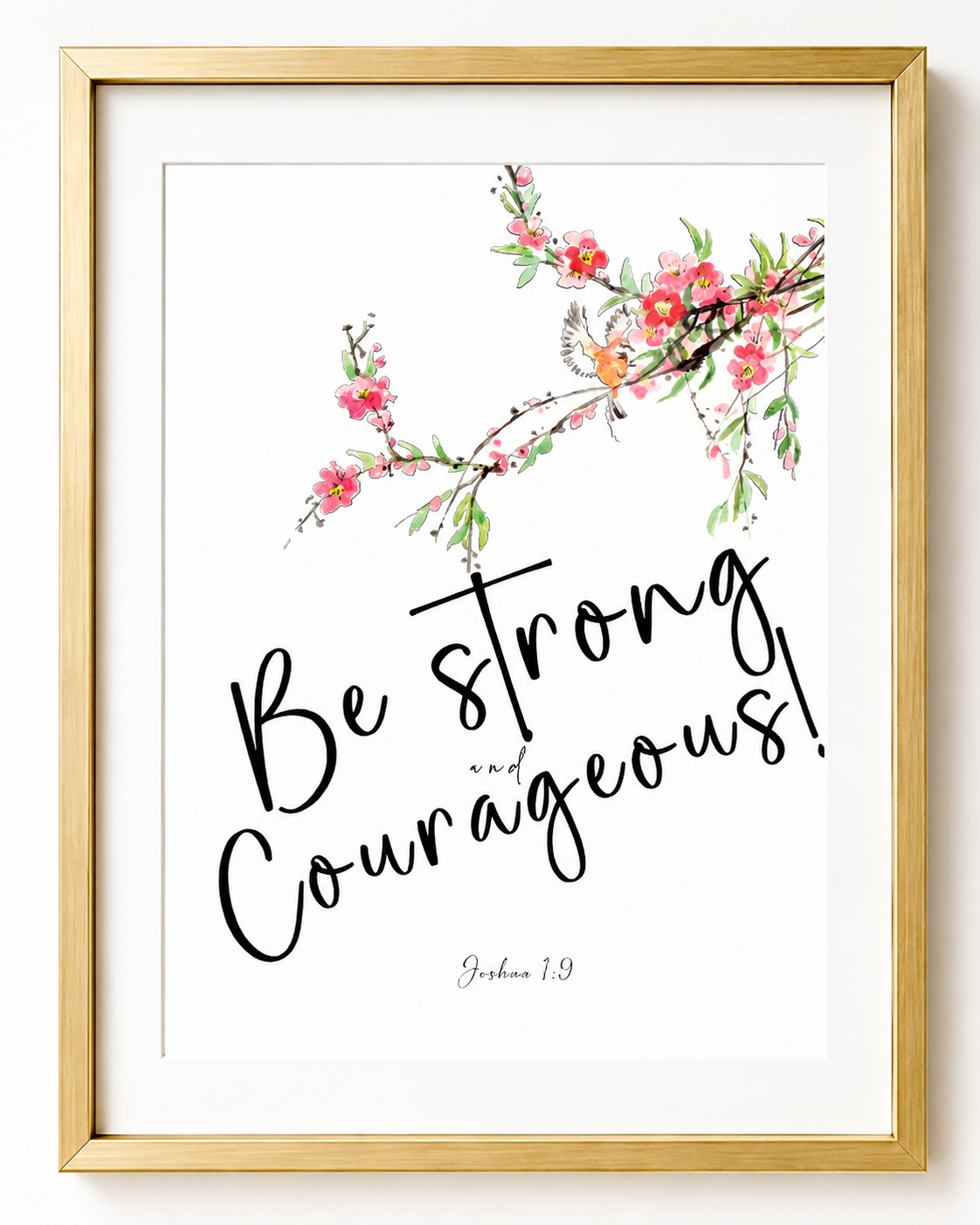 Close-up of Joshua 1:9 wall art print in a gold frame showing the hand-lettered script and floral branch design