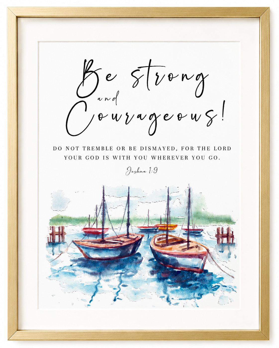 Gold-framed Joshua 1:9 nautical wall art print with hand-lettered "Be Strong and Courageous" text and watercolor boats, displayed in a living room