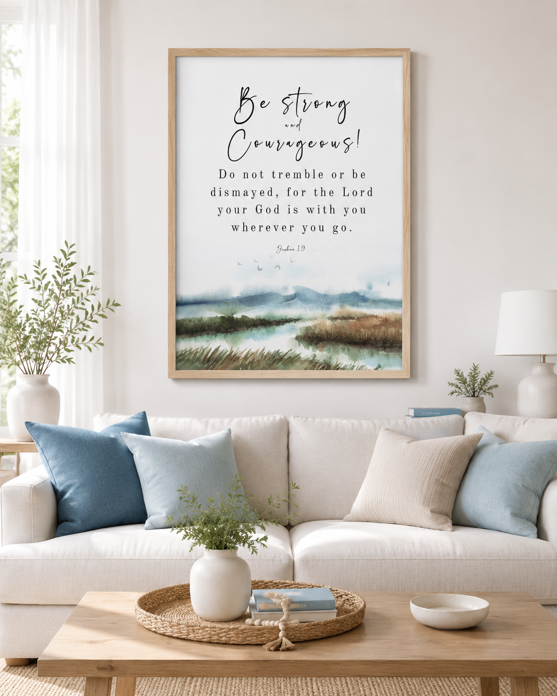Joshua 1:9 wall art print in a gold frame with "Be Strong and Courageous" scripture and watercolor landscape design