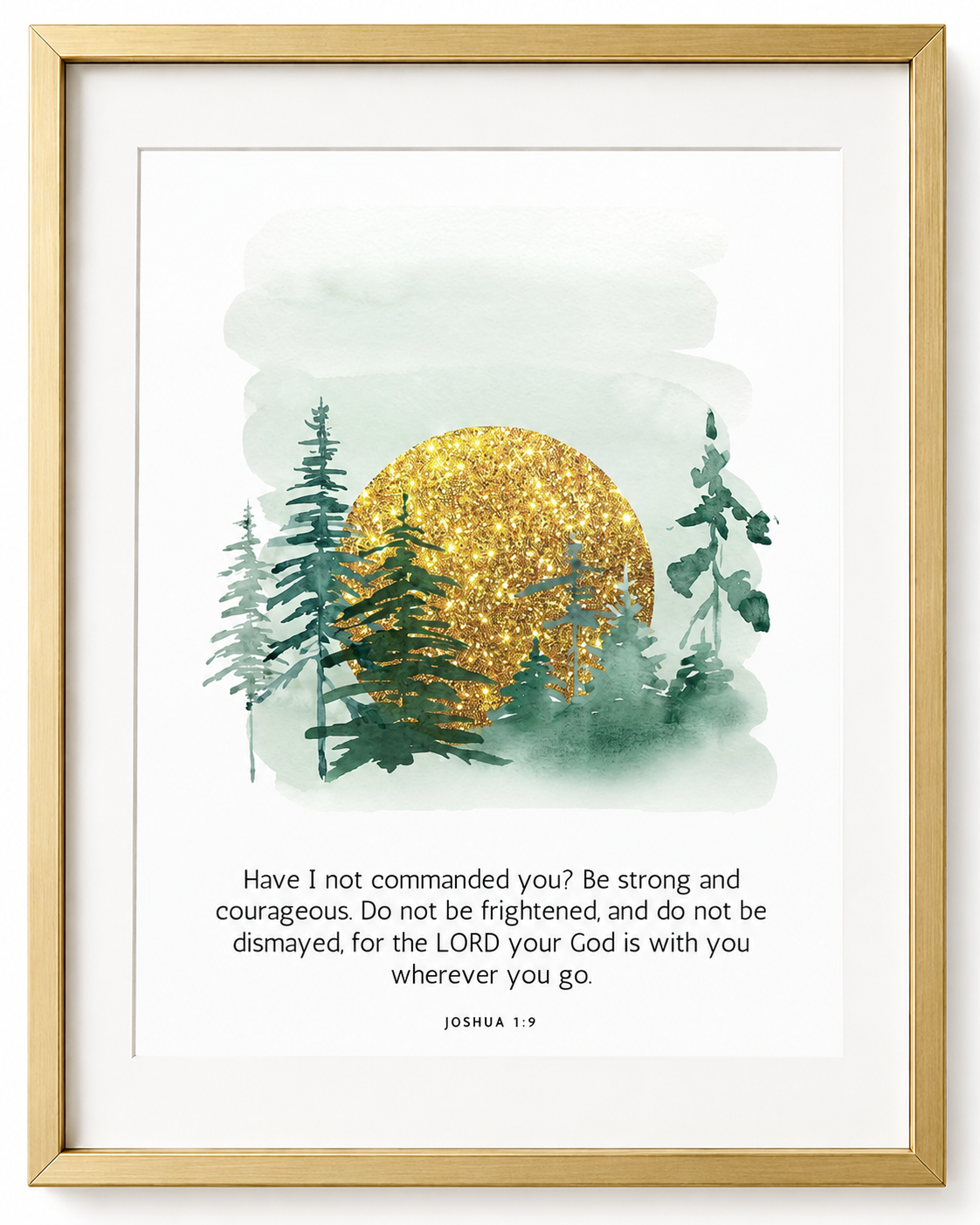 Black-framed Joshua 1:9 "wherever you go" wall art print with watercolor pine trees and a golden sun, displayed in a living room