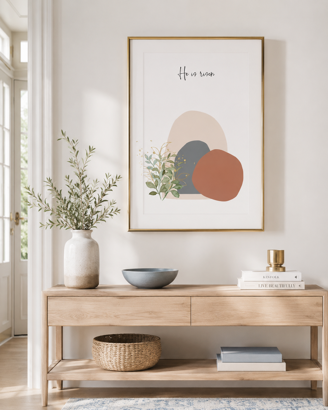He Is Risen print displayed on a mantel with a vase of flowers