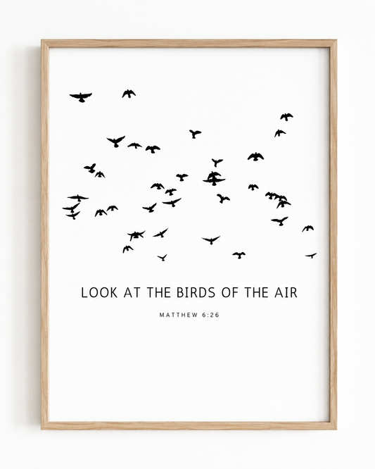 Close-up of Matthew 6:26 wall art print in a wood frame showing the minimalist bird design