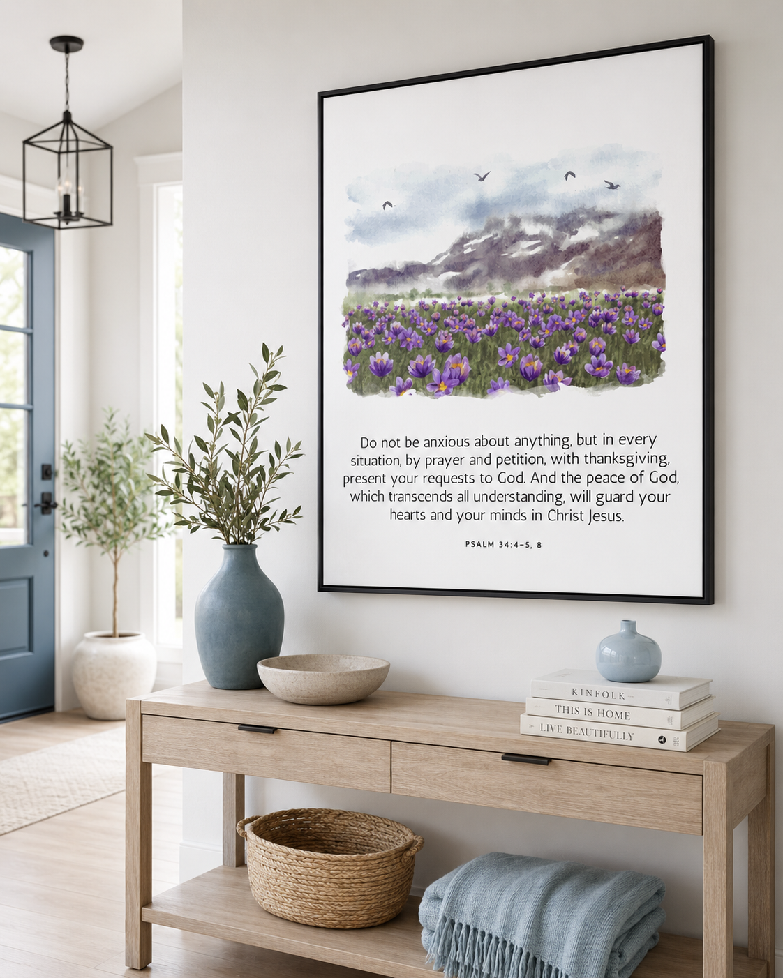 Framed Philippians 4:6-7 wall art print in a black frame on a console table