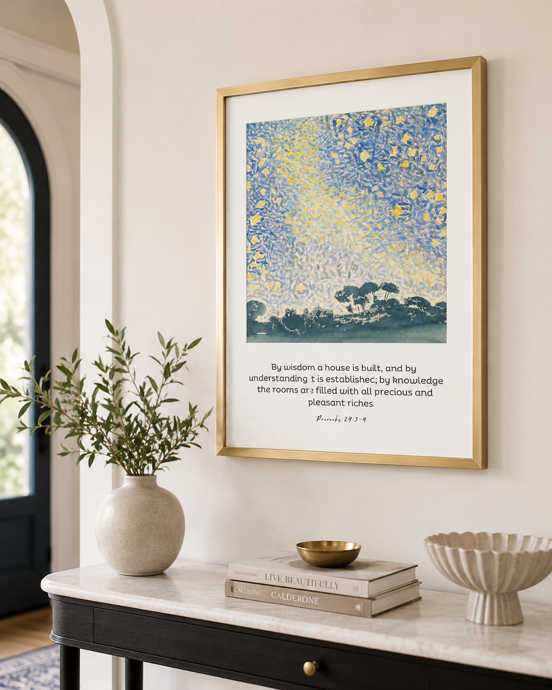 Framed Proverbs 24:3-4 wall art on a console table near an entryway