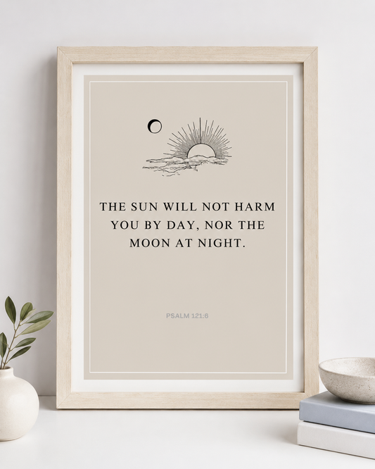 Close-up of Psalm 121:6 wall art print in a gold frame showing the sun and moon design and full verse text