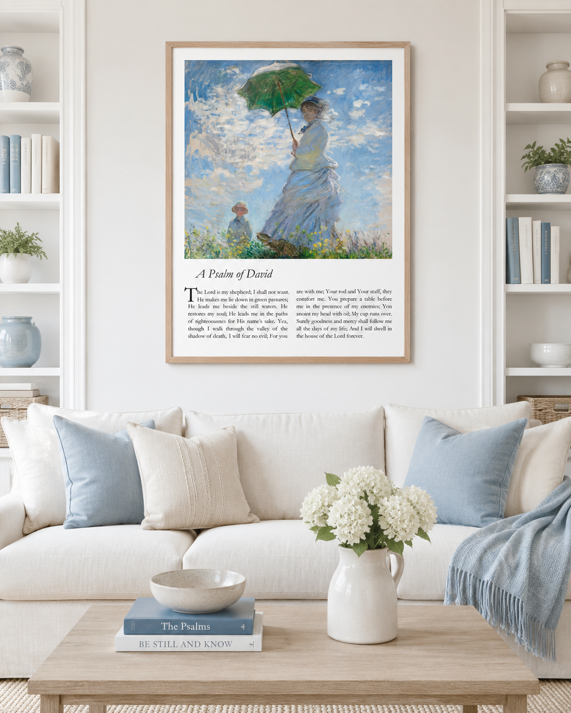 Wood-framed Psalm 23 art print with impressionist meadow painting, displayed above a sofa in a living room