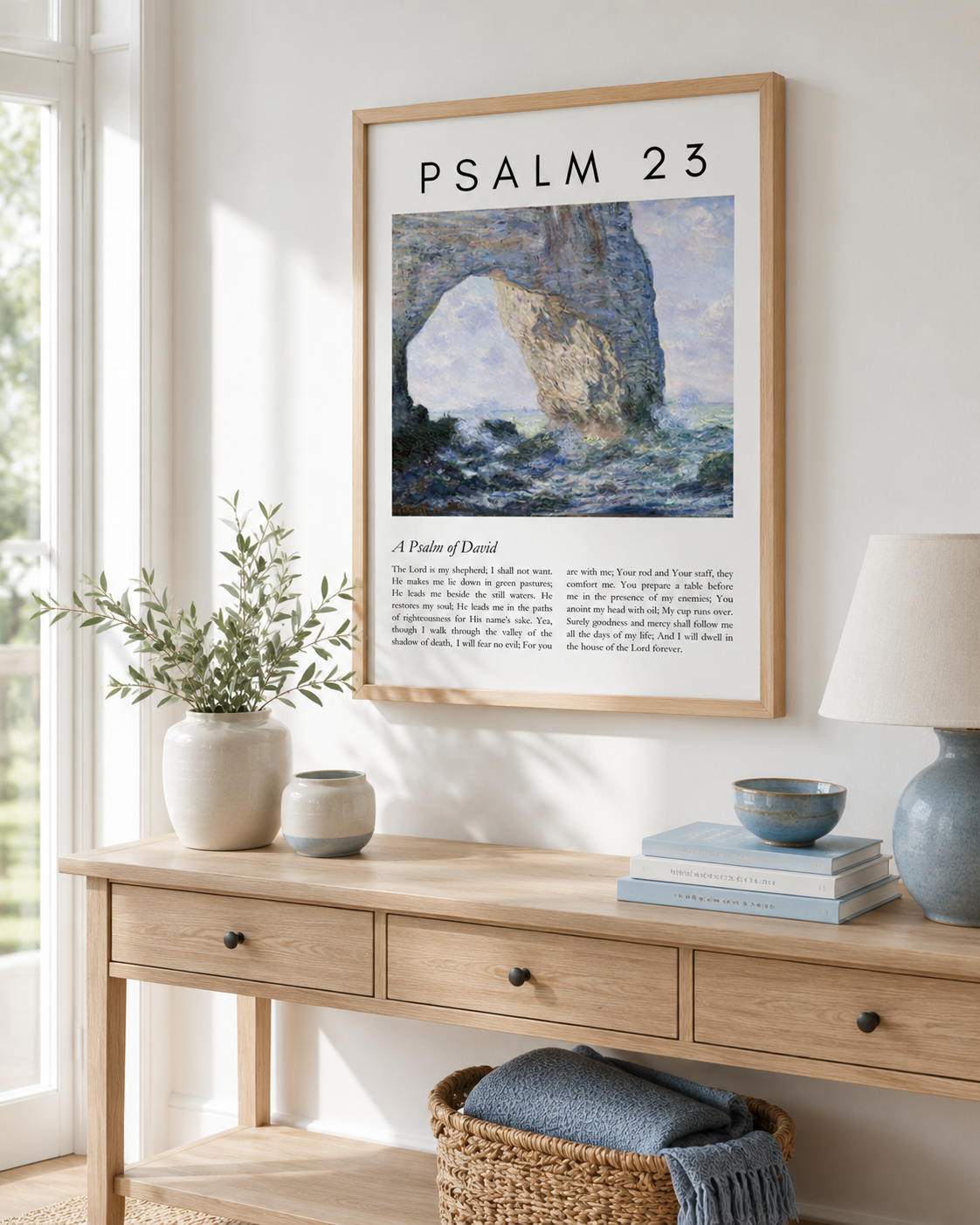 Framed Psalm 23 wall art print with coastal landscape displayed above a console table