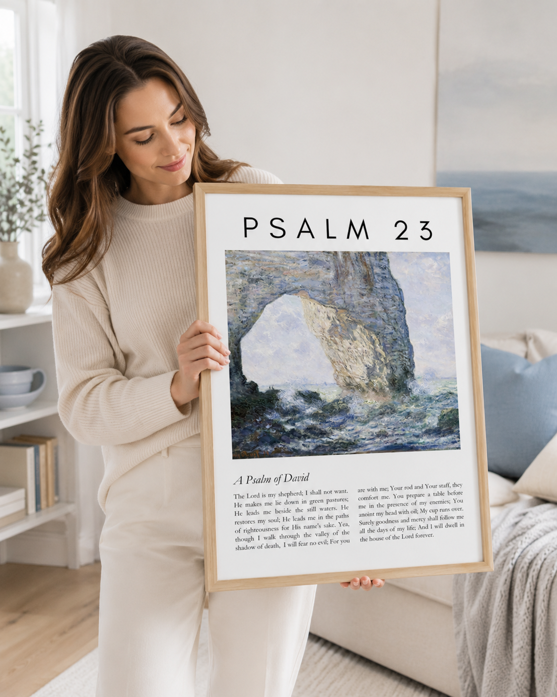 Woman holding a framed Psalm 23 wall art print with the complete psalm text