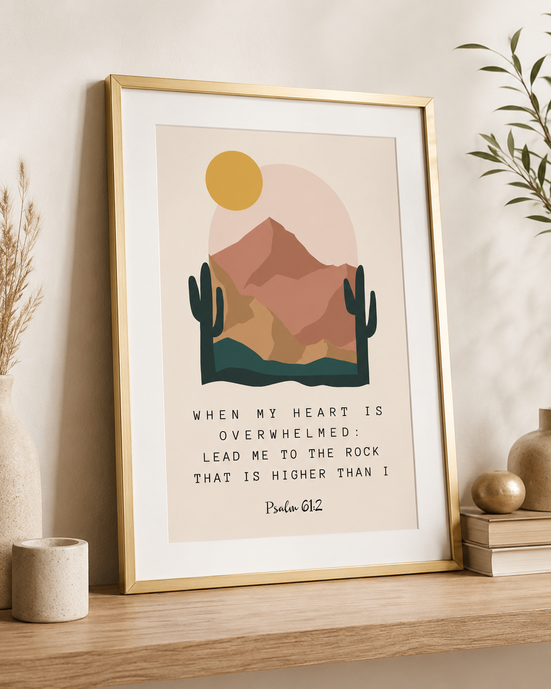 Gold-framed Psalm 61:2 wall art print displayed on a shelf with a plant