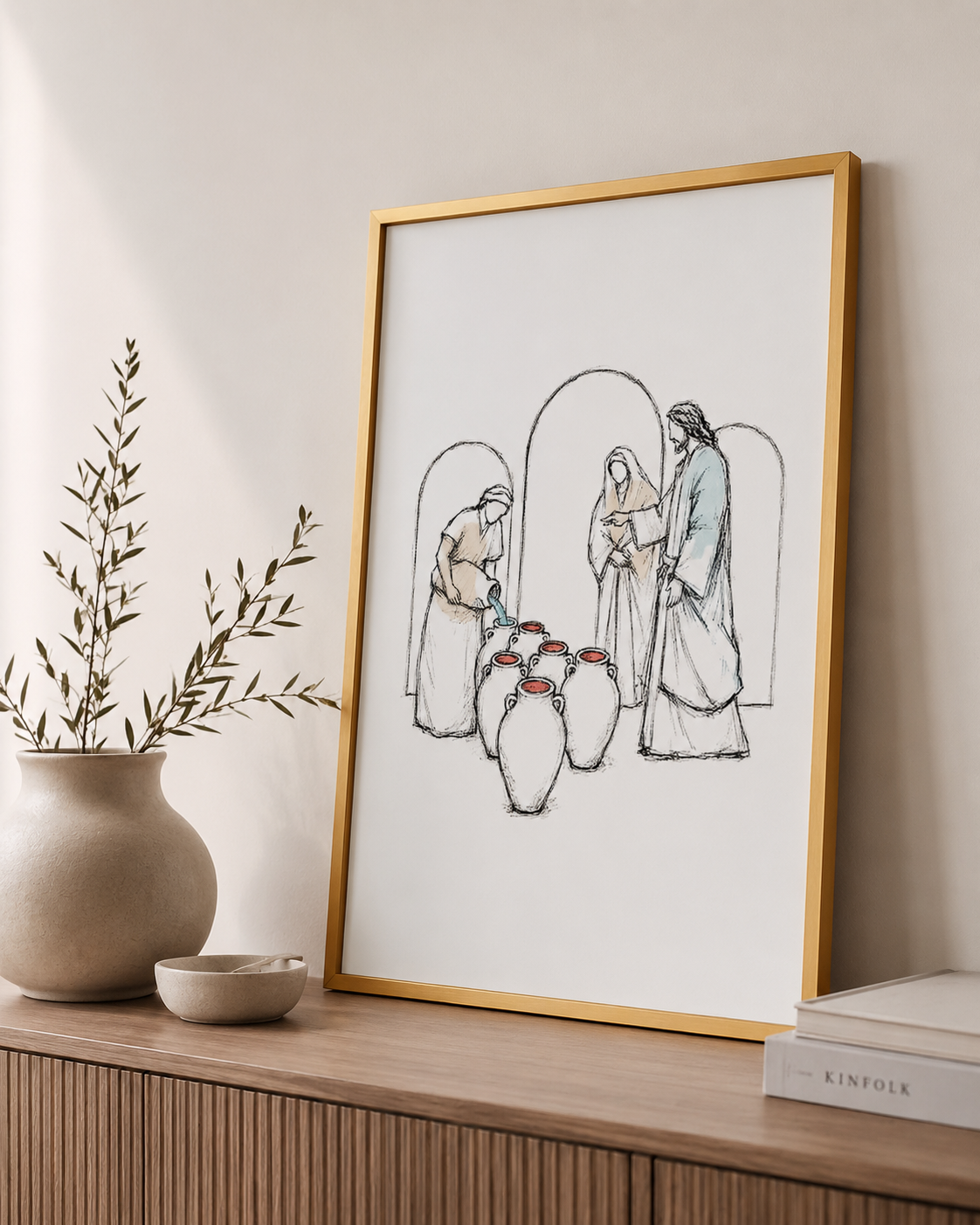 Wedding at Cana print framed in a reading nook with a side table
