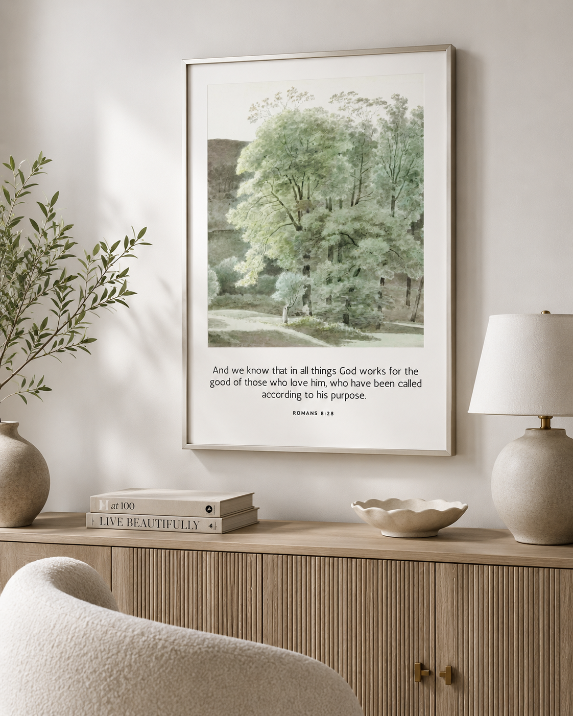 Romans 8:28 christian scripture wall art print displayed in a cozy home office reading corner