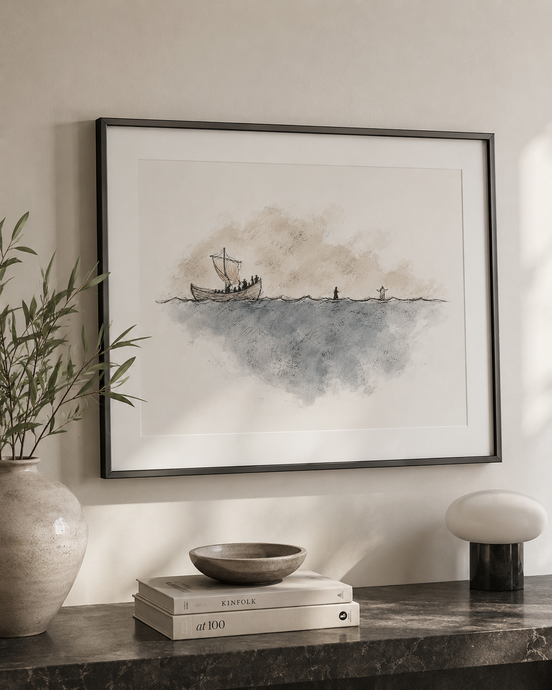 Watercolor walk on water sketch framed beside a vase on a side table